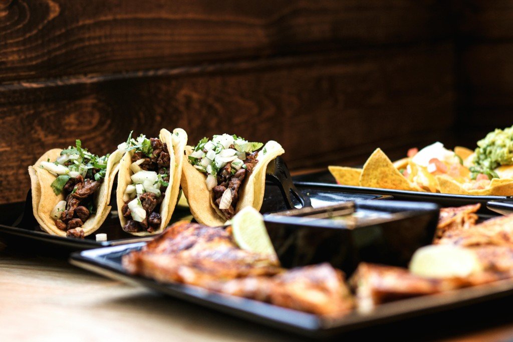 Carne asada street tacos with cilantro and onion, loaded nachos and quesadillas at Tequila Fuego Longview Washington